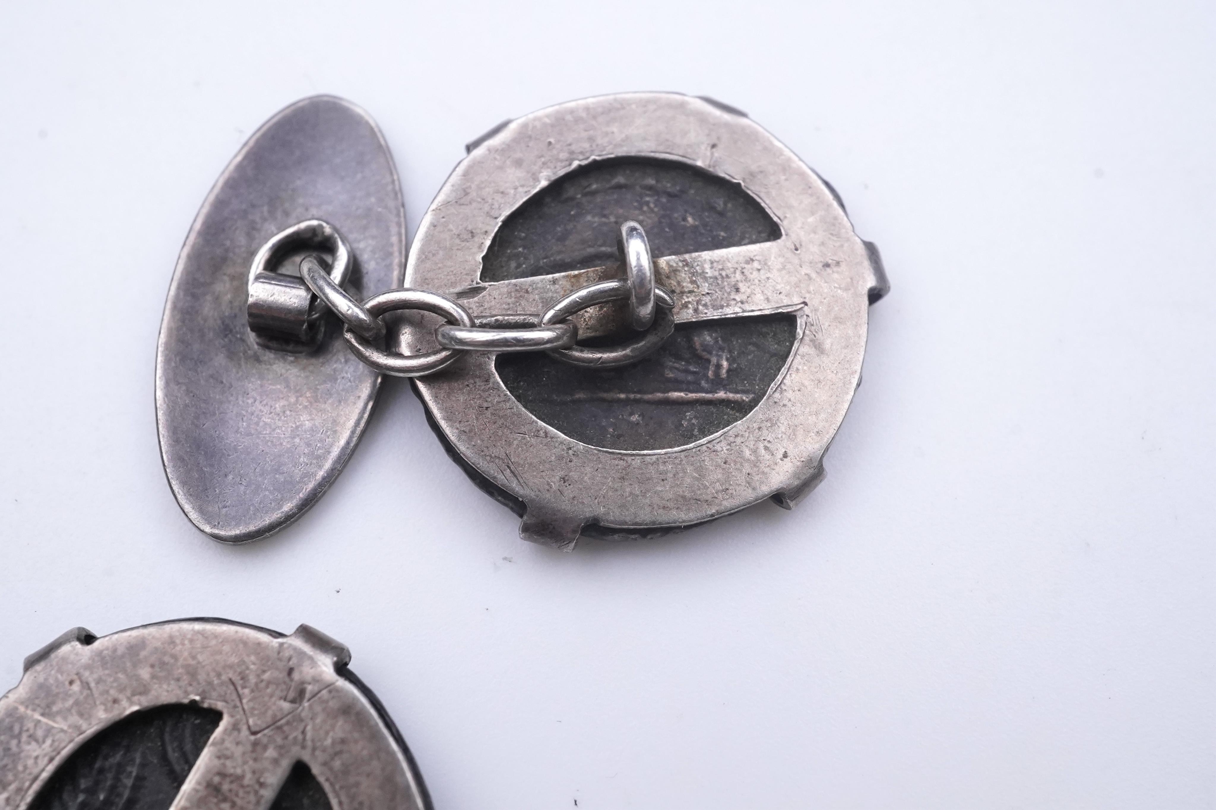 A pair of coin cufflinks